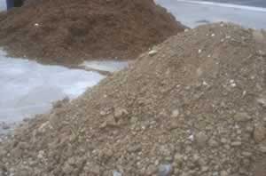 Stockpiled topsoil and new mulch